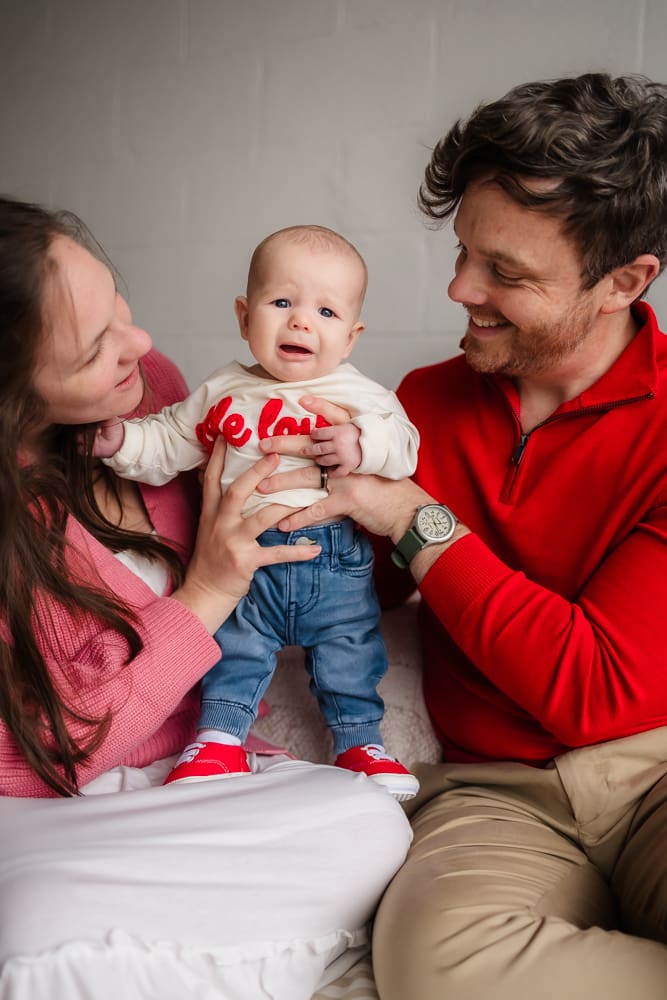 baby struggling during valentine's themed 3 month milestone photography session in knoxville tn