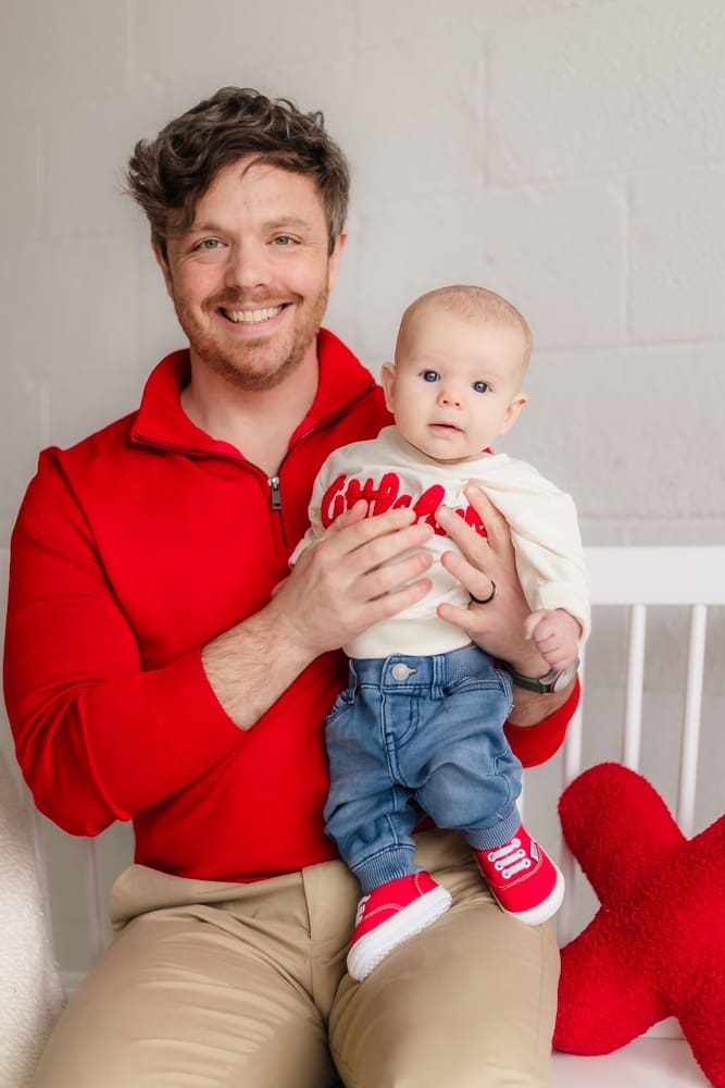 dad holding baby during valentine's themed 3 month milestone photography session in knoxville tn