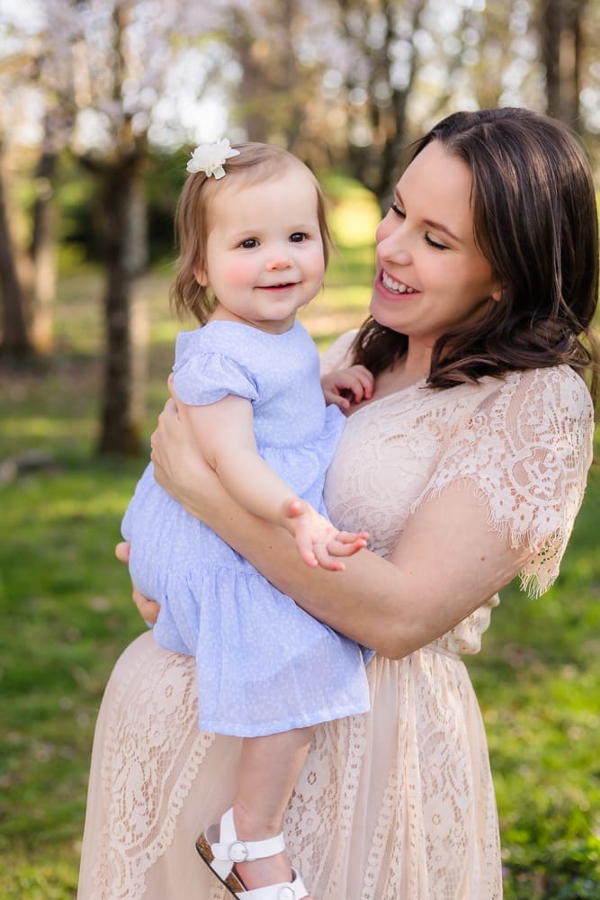 mom and youngest daughter during maternity photography session in knoxville tn