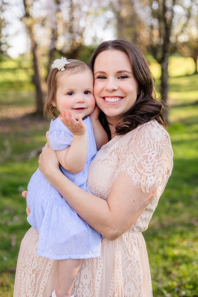mom and little daughter smile during maternity photography session in knoxville tn