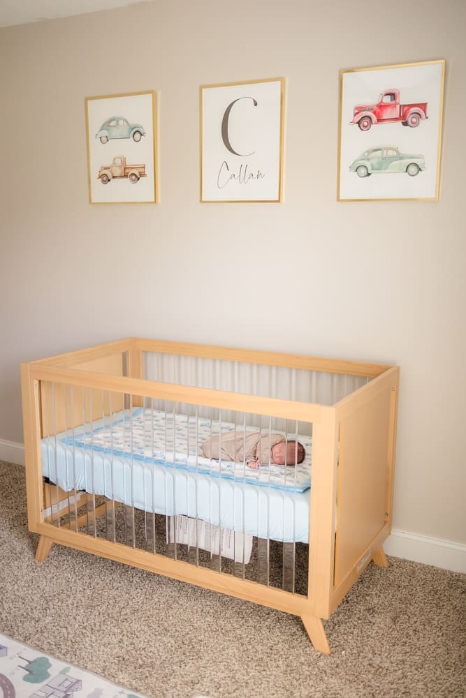 baby boy in crib during in home lifestyle newborn photography session in knoxville tn