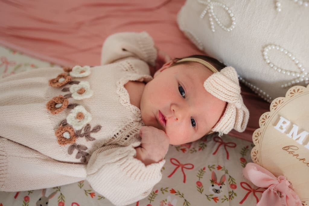 baby laying in crib during in-home lifestyle newborn session by knoxville newborn and maternity photographer Kelsey Wood Portraits.