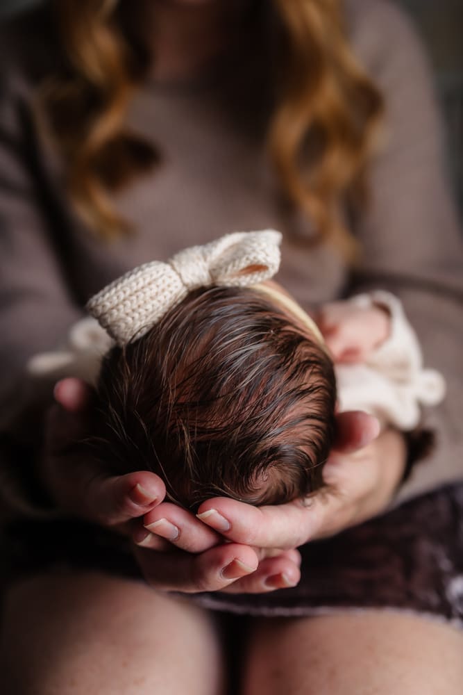 detail of newborn's head and hair during in-home lifestyle newborn session by knoxville newborn and maternity photographer Kelsey Wood Portraits.
