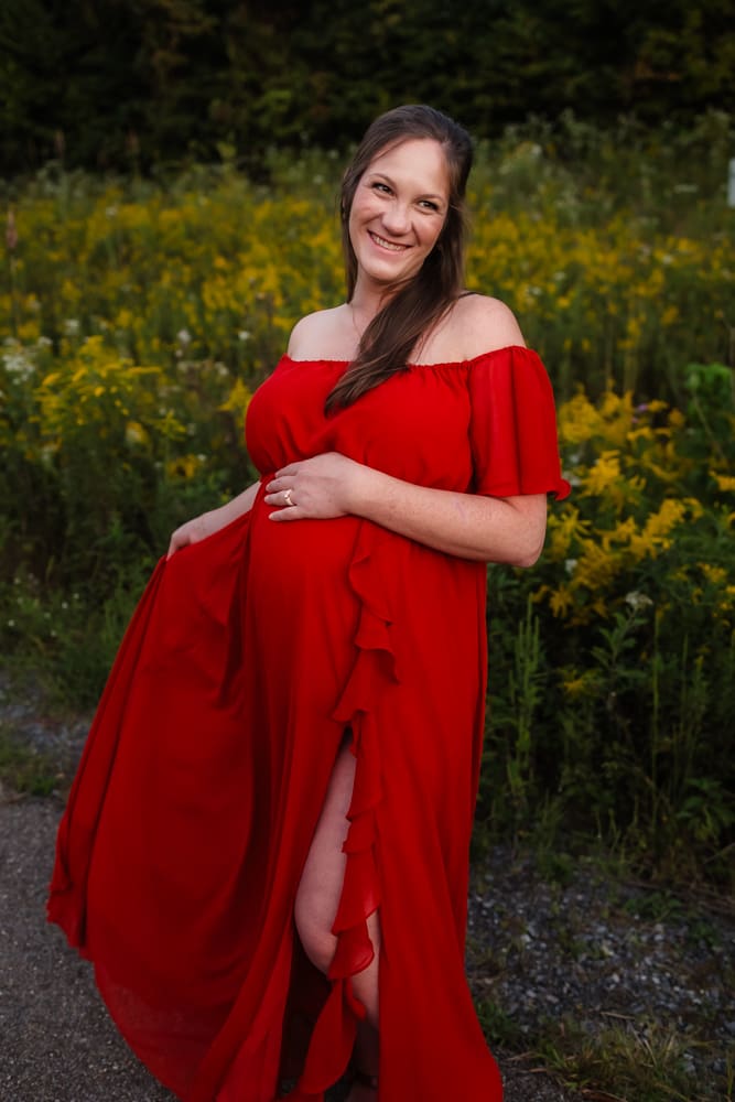 mom twirling dress during knoxville maternity photo shoot at seven isalnds park in kodak