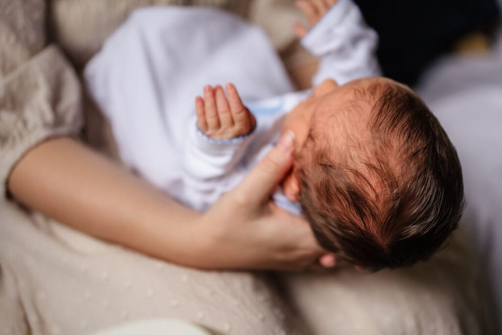baby hair during in-home lifestyle newborn photography session in knoxville tn