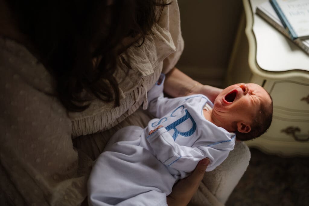 baby yawn during in-home lifestyle newborn photography session in knoxville tn