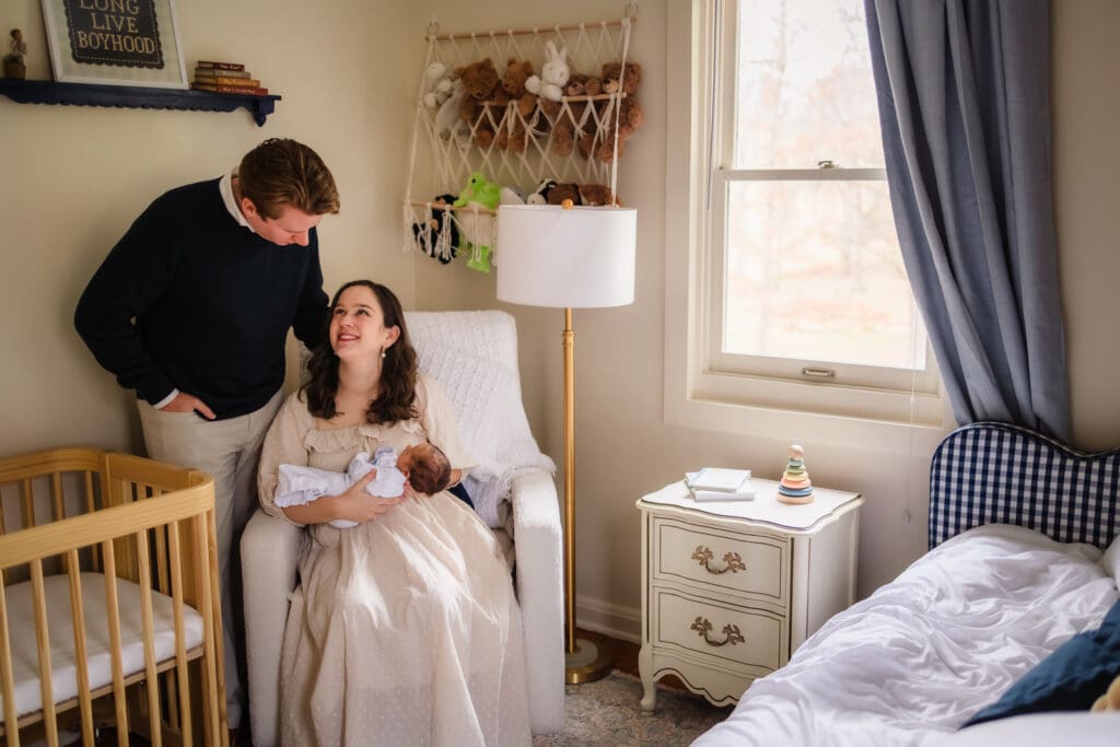 mom and dad in nursery during in-home lifestyle newborn photography session in knoxville tn
