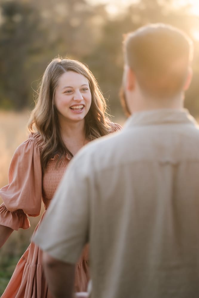 mom walking to dad during knoxville maternity photography session at the Holmstead studio