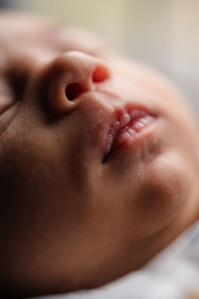 detail shot of baby's mouth during knoxville in-home lifestyle newborn photography session