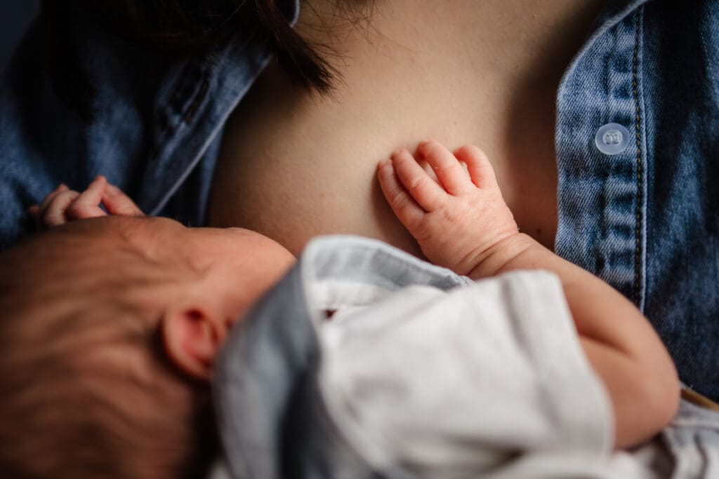detail of baby nursing during knoxville in-home lifestyle newborn photography session