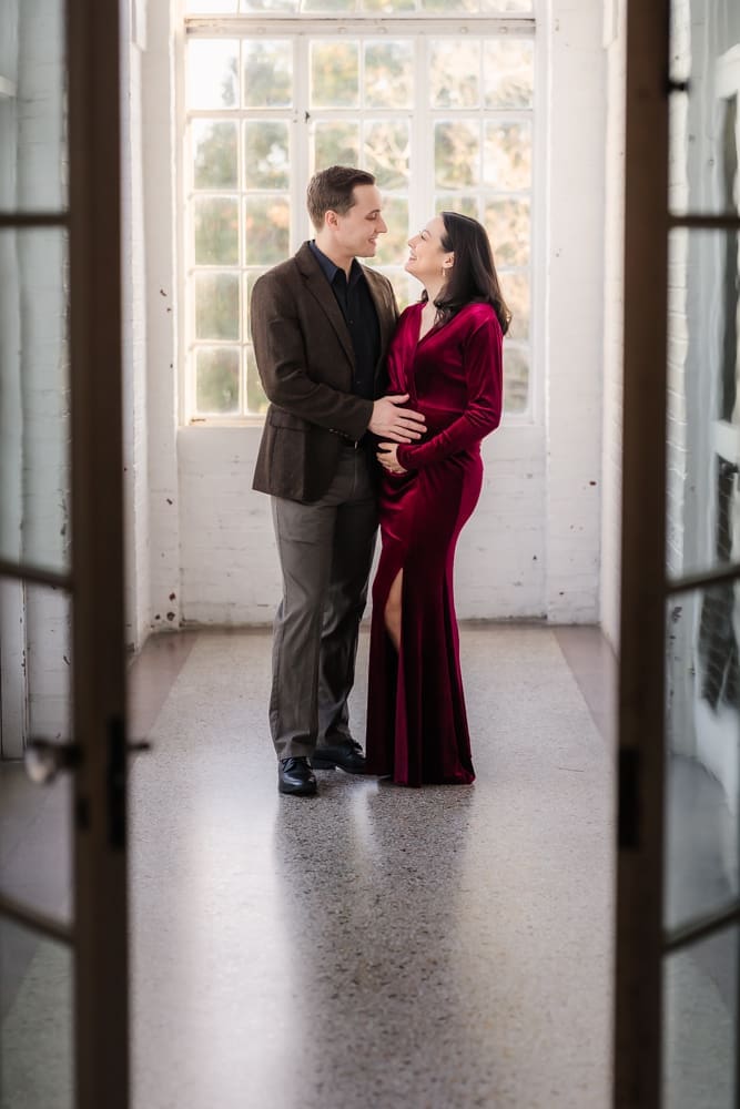 couple looking at each other during knoxville maternity session at the bleak house