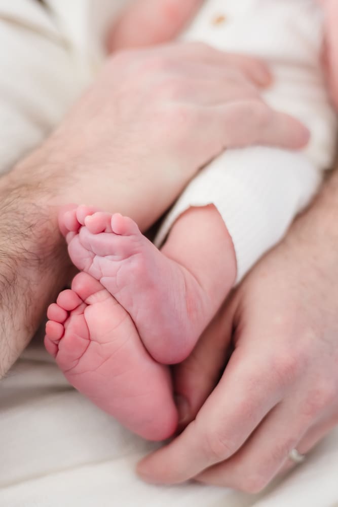 baby feet and toes during lifestyle newborn session in knoxville tn