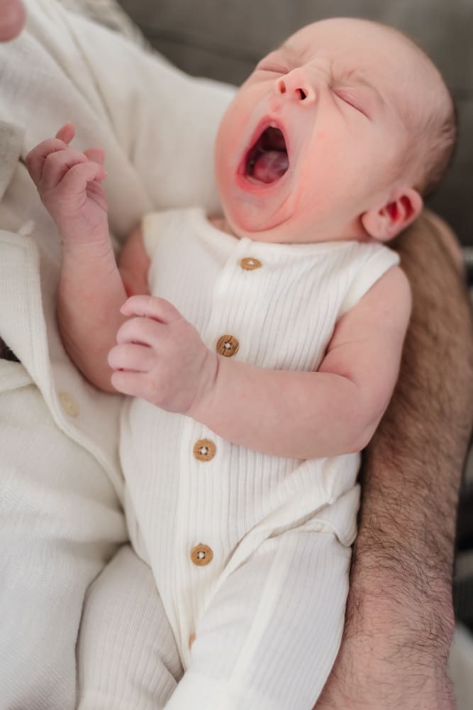 baby boy yawning during newborn session