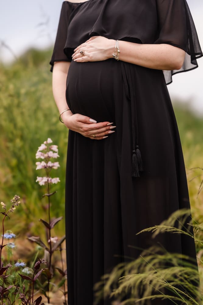 detail shot of baby bump during fantasy inspired knoxville maternity photography session at ancient lore village