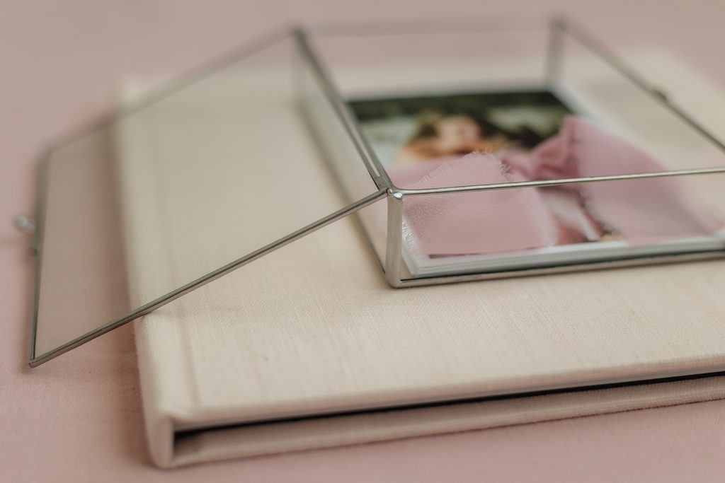 Glass photo box featuring printed images from an in-home newborn session in Powell TN