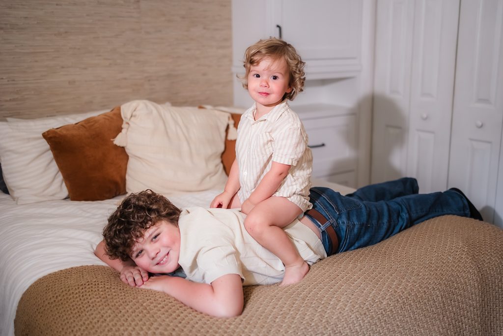 Brothers during a lifestyle newborn session in Powell TN for their newborn baby sister