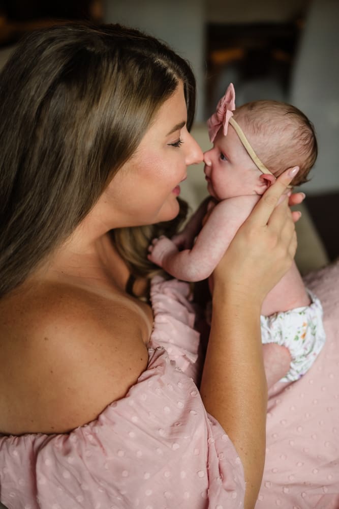 Mother nose to nose with her newborn baby girl during an in-home newborn session in Powell TN