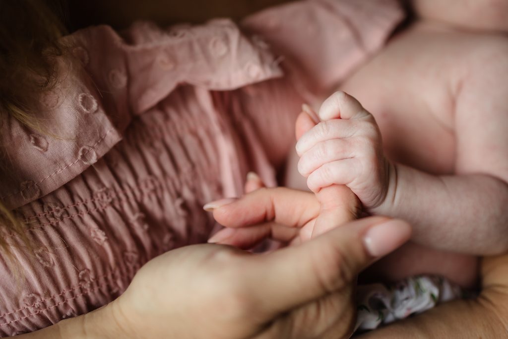 Close-up of a newborn baby's tiny hand during a Powell TN newborn photography session
