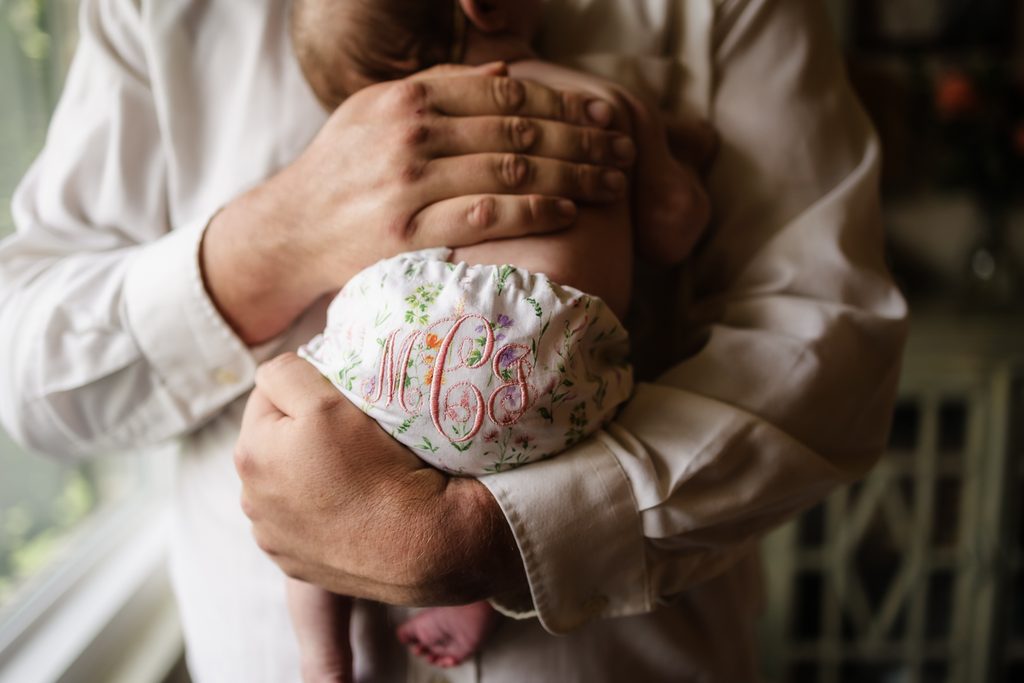 Newborn baby girl in floral monogrammed bloomers during a Powell TN newborn photography session